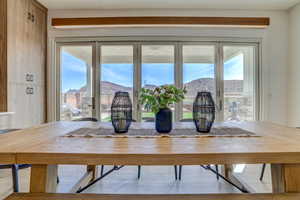 Dining space featuring a mountain view and plenty of natural light