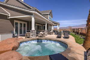 View of pool featuring a patio, a mountain view, and a fenced backyard