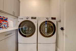 Laundry room with washer and dryer and cabinet space