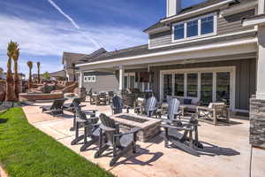 View of patio / terrace featuring an outdoor fire pit, a ceiling fan, and area for grilling