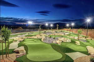 View of home's community featuring a putting area