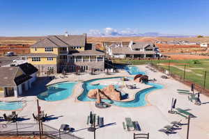 Community pool featuring a patio area and a residential view