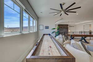 Recreation room featuring a ceiling fan and recessed lighting