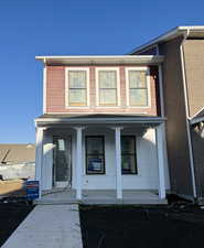 (Actual Home) View of front of house featuring covered porch