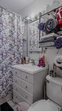 Full bath with vanity and tile patterned floors
