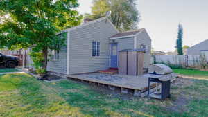 Back of house featuring a deck and a chimney