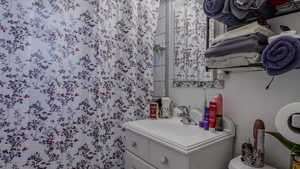 Bathroom featuring vanity and toilet