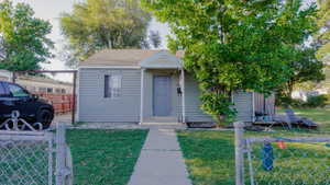 Bungalow-style home featuring roof with shingles