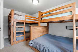 Bedroom with light colored carpet