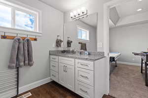 Bathroom with vanity and dark wood-style floors