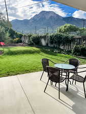 View of patio with outdoor dining space and a mountain view