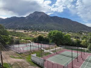 View of tennis courts in park next door-  featuring a mountain view