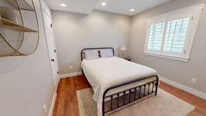 Bedroom with recessed lighting and light wood-style flooring