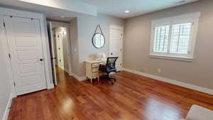 Office featuring dark wood finished floors and recessed lighting