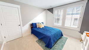 Bedroom featuring carpet flooring