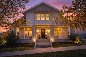 View of front of house with a porch and board and batten siding