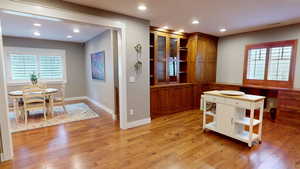 Dining area featuring healthy amount of natural light, light wood-type flooring, and recessed lighting