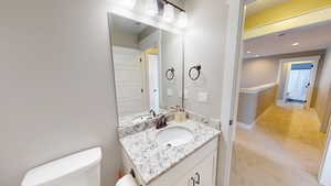 Bathroom featuring vanity and recessed lighting