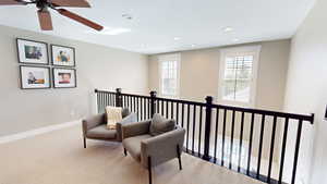 Sitting room featuring carpet floors, recessed lighting, and a ceiling fan