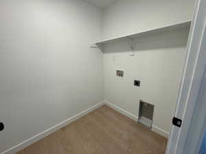 Washroom featuring light wood-style floors, washer hookup, and electric dryer hookup