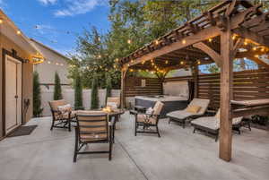 View of patio / terrace with a fire pit and a pergola