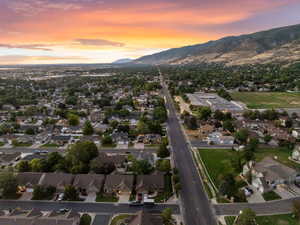 Aerial overview of property's location featuring nearby suburban area and mountains