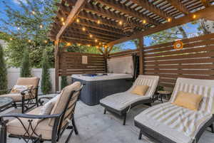 View of patio featuring a hot tub