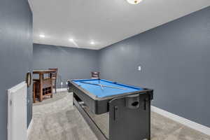 Playroom with light carpet, pool table, recessed lighting, and a textured ceiling