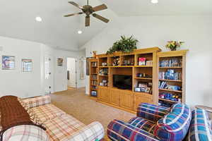 Living area featuring light colored carpet, recessed lighting, a ceiling fan, and high vaulted ceiling