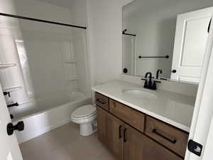 Full bathroom featuring vanity,  shower combination, and light tile patterned flooring
