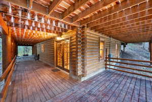 Wooden deck featuring french doors