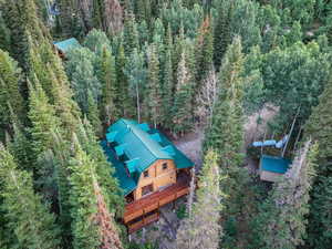 View of subject property with a heavily wooded area