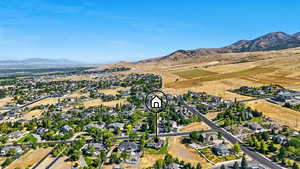 Aerial view of residential area featuring a mountainous background