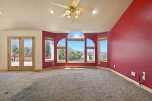 Unfurnished living room with carpet, ceiling fan, recessed lighting, and lofted ceiling