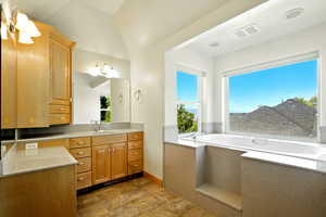 Bathroom featuring a bath and vanity