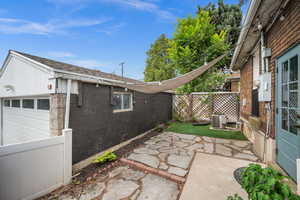 View of patio featuring detached garage