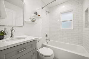 Full bathroom featuring shower / bathtub combination and vanity