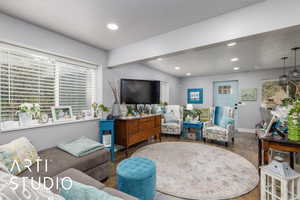ADU Living area featuring a textured ceiling, recessed lighting, and wood finished floors