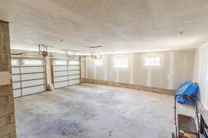 Garage featuring a garage door opener