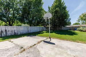 Fenced backyard featuring a patio