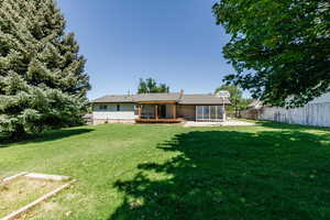 Rear view of house featuring a patio