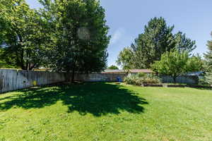 View of fenced backyard