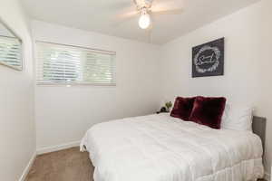 Bedroom featuring carpet floors and a ceiling fan