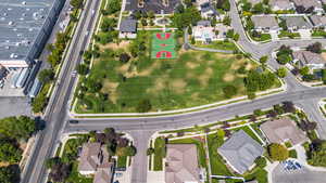 Aerial view of property and surrounding area with nearby suburban area