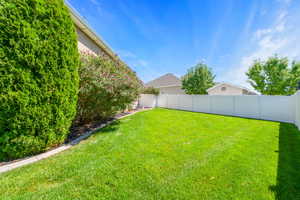 View of fenced backyard