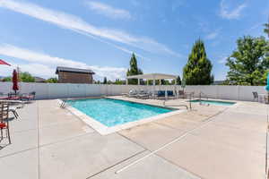 Community pool with a patio