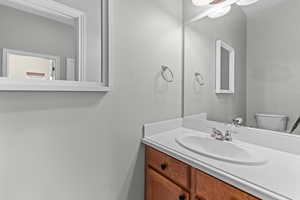 Bathroom featuring vanity and toilet