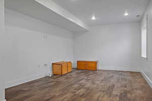 Spare room with recessed lighting and dark wood-type flooring