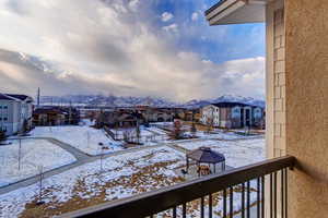 Balcony with a residential view and a mountain view