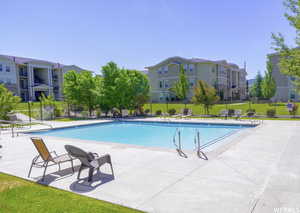 Community pool with a patio area